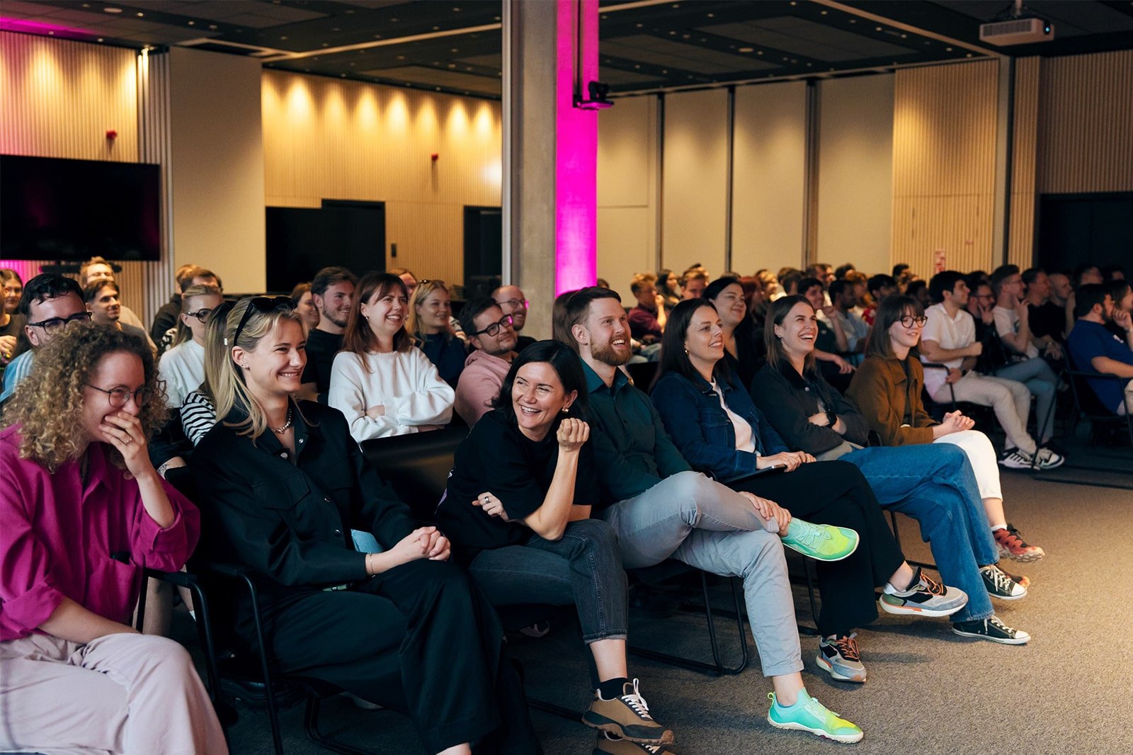 people laughing at event